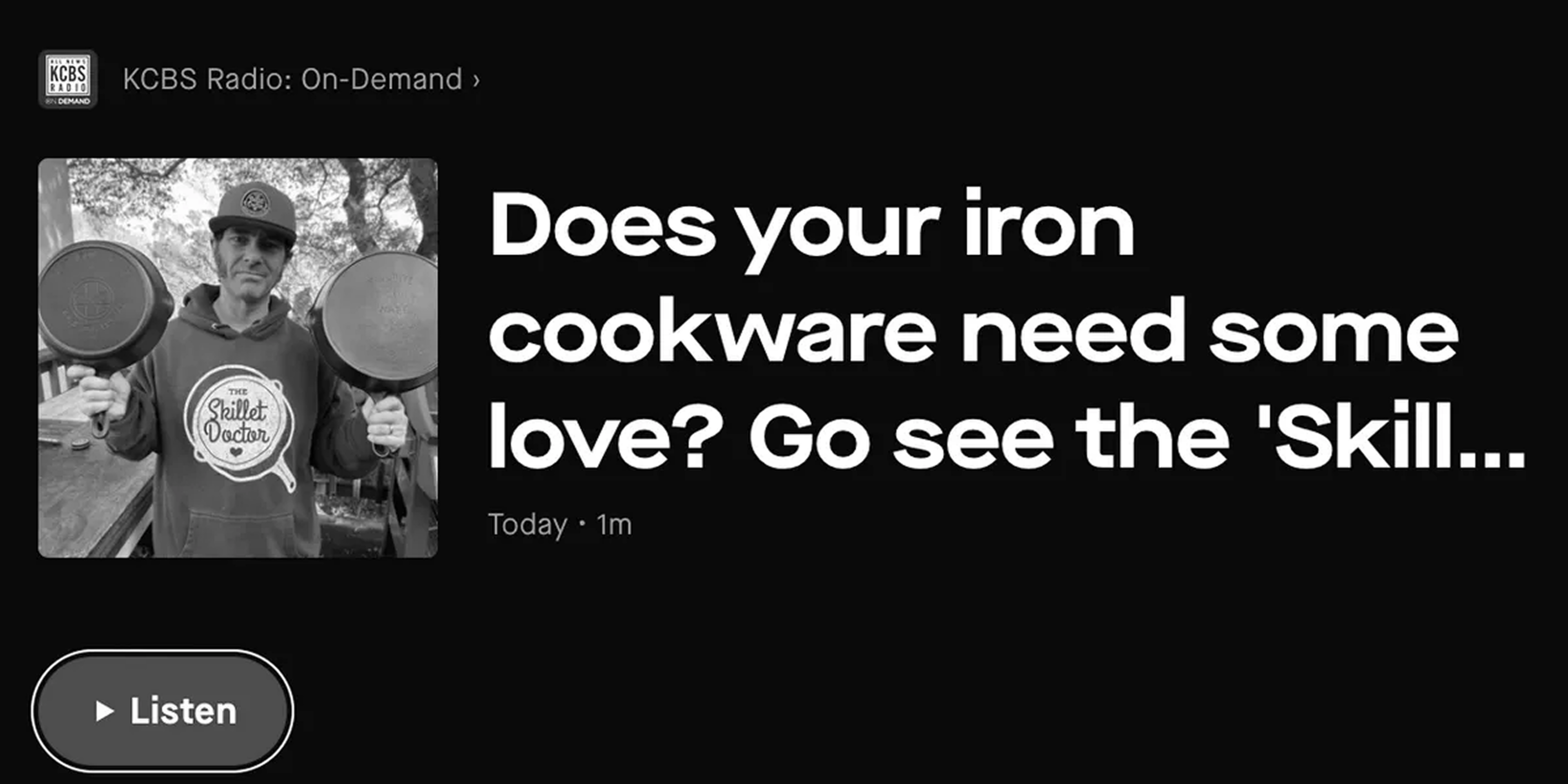 Person holding iron cookware pans