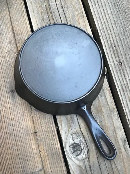 Cast iron skillet on wooden surface