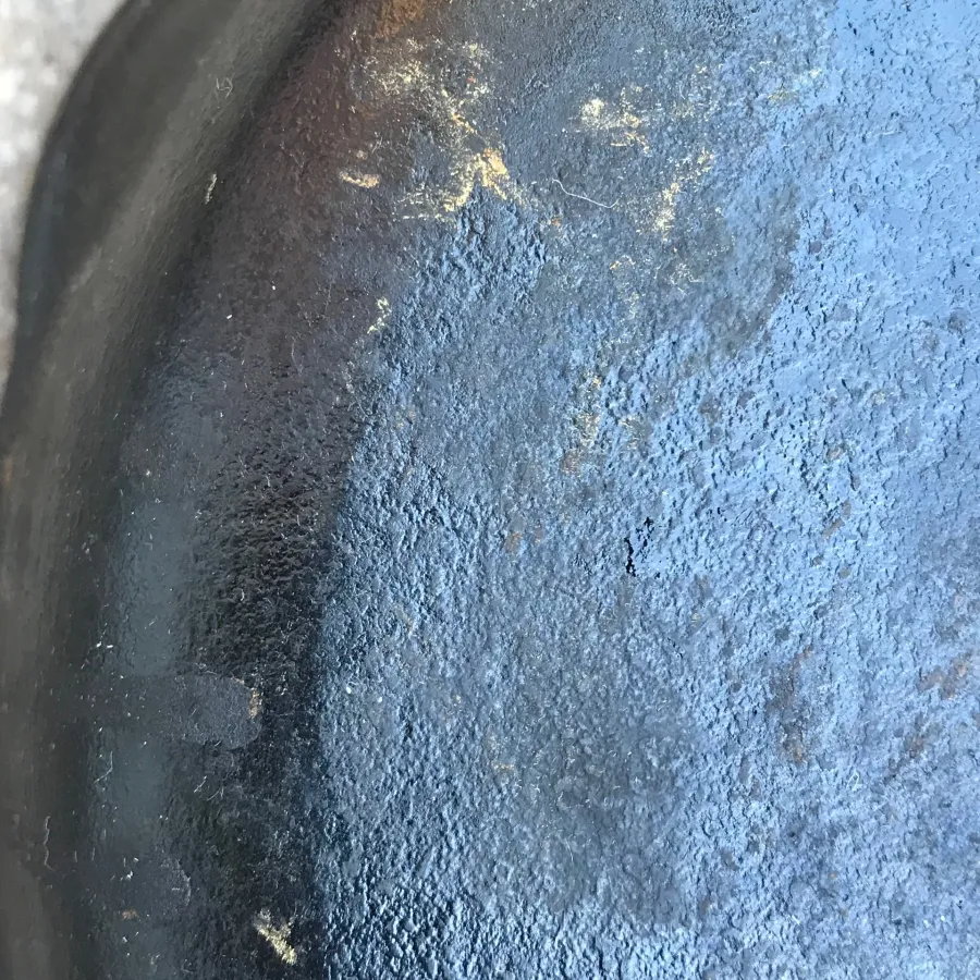 Close-up of a seasoned cast iron pan
